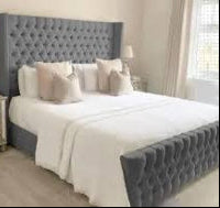 Elegant Gray Upholstered Bed with Tufted Headboard